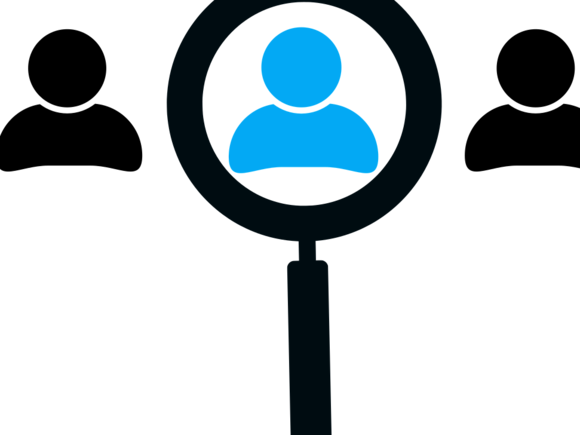 Ein Arbeitnehmer wird mit einer Lupe hervorgestellt